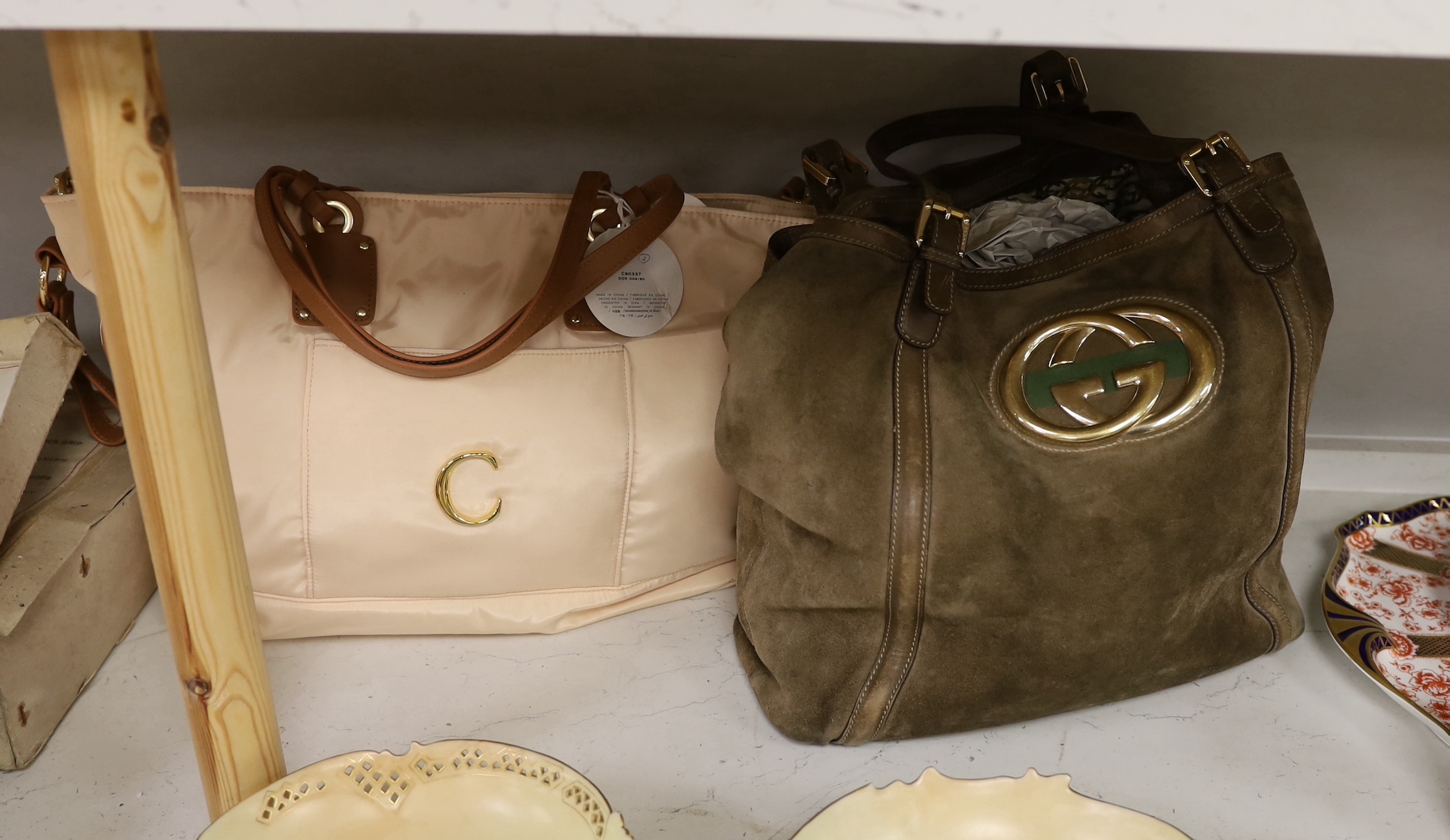 A Gucci brown suede and leather shoulder bag with gilt monogram badge, together with a Chloe handbag